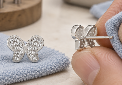 Butterfly pavé earrings checked with a cloth