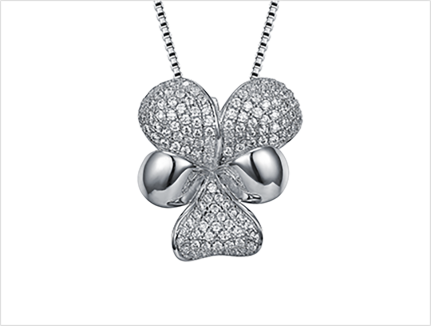 Pavé bowknot cubic zirconia pendant with polished ribbon loops and a fine chain