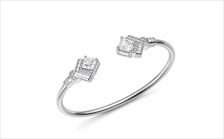 Open cuff bracelet with controlled opening and stone-set ends