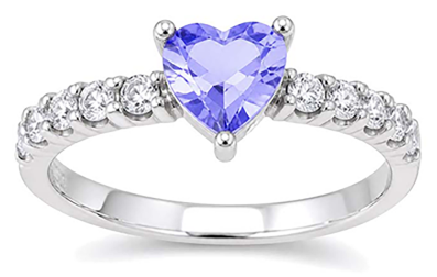Ring with a heart-shaped center gem and polished band