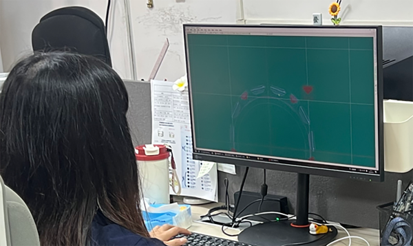 Designer preparing renders and technical drawings in the studio