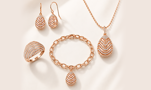 Rose gold jewelry set with matching earrings, bracelet and pendant necklace