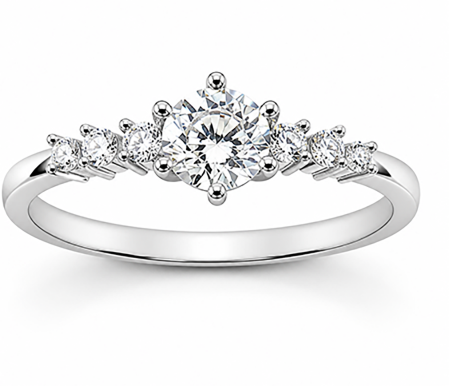 Mix-cut stone ring with graduated pavé-set stones across the band