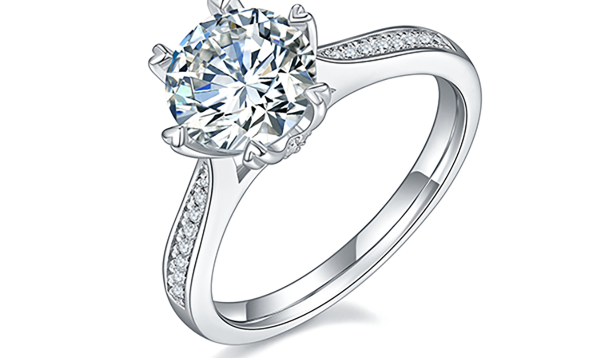 Solitaire ring with a round brilliant center stone and pavé shoulders