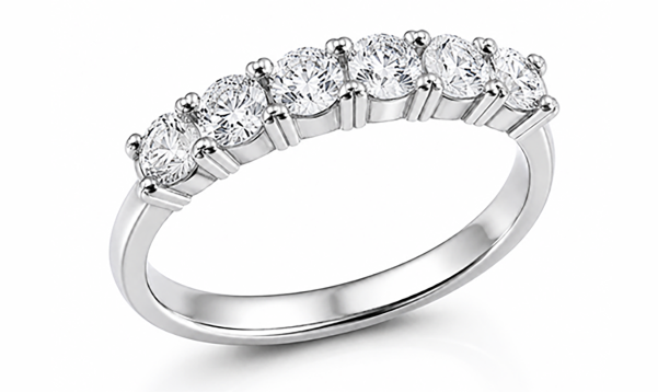 Five stone ring with a row of round brilliant stones across the band