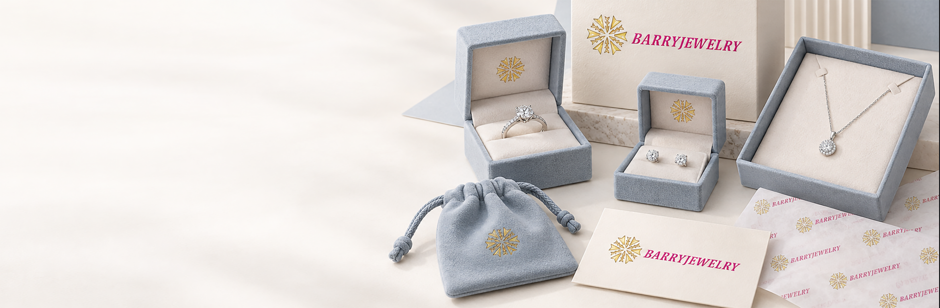 Custom jewelry packaging set with branded boxes, a pouch and printed logo cards in blue and cream