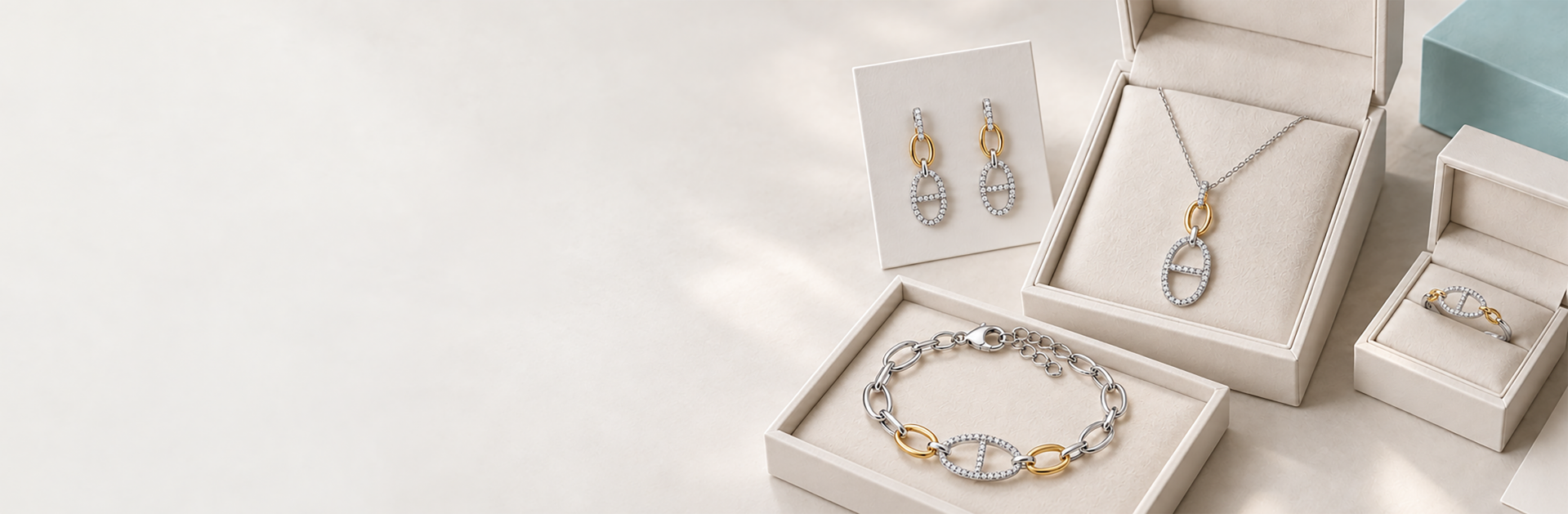 Private label jewelry collection in branded boxes — diamond bracelet, pendant necklace and earrings with logo engraving