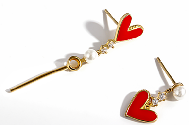 Pair of earrings translating a pendant motif with a heart detail