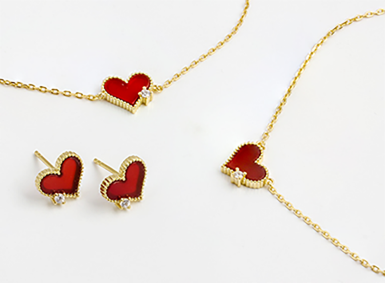 Coordinated set with a red heart motif necklace and matching earrings