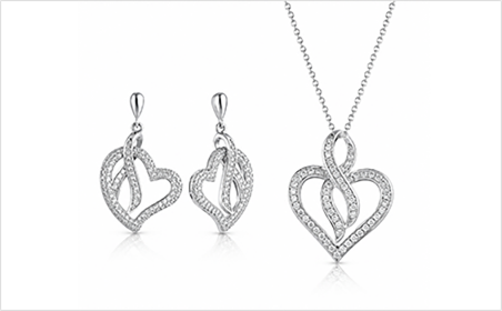 Coordinated heart motif pendant and earring set in polished silver
