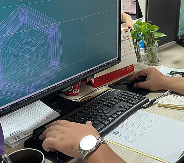 Jewelry CAD designer adjusting a wireframe ring model on a workstation screen